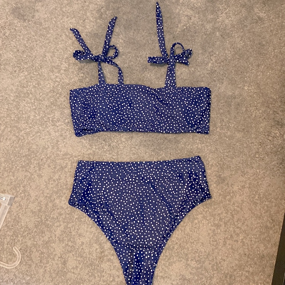 Blue and white polka dot high waisted swimsuit.